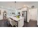 Well-lit kitchen features an island with bar stools, stainless steel appliances, and hardwood floors at 351 Gaines St, Marietta, GA 30060