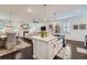 Open concept kitchen featuring a white island and views into the living room with fireplace at 351 Gaines St, Marietta, GA 30060