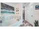 Inviting bathroom features tub with decorative tile accents and separate shower at 351 Gaines St, Marietta, GA 30060