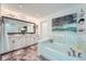Luxurious main bathroom with double vanity, soaking tub, and tiled floors at 351 Gaines St, Marietta, GA 30060