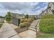 Attractive condos line a manicured street with lush bushes, sidewalk access, outdoor mailboxes, and convenient stairway access at 351 Gaines St, Marietta, GA 30060