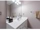 Bathroom featuring a white vanity, a large mirror, and neutral wall color at 4470 Crestwicke Pointe, Atlanta, GA 30319