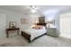Serene bedroom featuring a bed, a chest and artwork, providing a peaceful retreat at 4470 Crestwicke Pointe, Atlanta, GA 30319