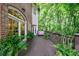 Spacious deck with wooden floors and railings, offering an inviting outdoor living space with views of surrounding greenery at 4470 Crestwicke Pointe, Atlanta, GA 30319