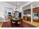 Open dining room with hardwood floors, chandelier, and sightlines to living room and adjoining spaces at 4470 Crestwicke Pointe, Atlanta, GA 30319