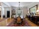 Spacious dining room featuring hardwood floors, elegant decor, and abundant natural light at 4470 Crestwicke Pointe, Atlanta, GA 30319