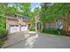 Charming brick home with a two-car garage and beautifully landscaped yard, set in a lush, green environment at 4470 Crestwicke Pointe, Atlanta, GA 30319