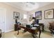 A cozy home office with wood desk, professional decor, and neutral paint at 4470 Crestwicke Pointe, Atlanta, GA 30319