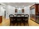 Spacious kitchen island with granite countertops, seating, and modern appliances including a stainless steel refrigerator at 4470 Crestwicke Pointe, Atlanta, GA 30319