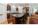 Open kitchen with a large island, granite countertops, seating, and stainless steel appliances including a gas cooktop at 4470 Crestwicke Pointe, Atlanta, GA 30319