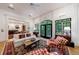 Bright living room with a fireplace, large windows, and views to the kitchen, and comfortable seating at 4470 Crestwicke Pointe, Atlanta, GA 30319