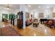 Cozy living room featuring hardwood floors, elegant decor, a piano, and ample natural light at 4470 Crestwicke Pointe, Atlanta, GA 30319