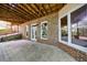 Outdoor patio with brick walls, featuring windows and doors, ideal for entertaining or relaxing in the backyard at 4470 Crestwicke Pointe, Atlanta, GA 30319