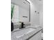 Modern bathroom featuring a black faucet, granite countertops, and a black framed mirror at 845 Heritage Dr, Stone Mountain, GA 30088