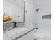 Updated bathroom features a black rain shower head and granite vanity at 845 Heritage Dr, Stone Mountain, GA 30088