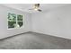 Neutral bedroom with large window and plush carpeting at 845 Heritage Dr, Stone Mountain, GA 30088