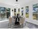 Dining area with a modern chandelier, a round table and lots of natural light at 845 Heritage Dr, Stone Mountain, GA 30088