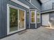 Exterior patio view showcasing sliding glass doors and a bay window at 845 Heritage Dr, Stone Mountain, GA 30088