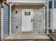 Up close view of the home's beautiful stone entryway and white front door at 845 Heritage Dr, Stone Mountain, GA 30088