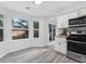 Well-lit kitchen featuring stainless appliances, granite counters, and bright lighting at 845 Heritage Dr, Stone Mountain, GA 30088