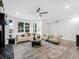 Bright and airy living room with modern furniture, a ceiling fan, and beautiful natural light at 845 Heritage Dr, Stone Mountain, GA 30088