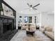 Bright living room with sleek gray laminate flooring, fireplace, and picture windows at 845 Heritage Dr, Stone Mountain, GA 30088