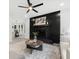 Beautiful living room with dark fireplace and gray accent rug at 845 Heritage Dr, Stone Mountain, GA 30088