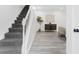 Inviting entrance with a carpeted staircase, hardwood floors and neutral decor at 845 Heritage Dr, Stone Mountain, GA 30088