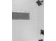 Modern shower with white tile, dark accents, and a built-in niche at 845 Heritage Dr, Stone Mountain, GA 30088