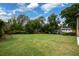 Spacious backyard with lush green lawn, mature trees, and manicured landscaping, providing a serene outdoor space at 22 Mount Paran Rd, Atlanta, GA 30327