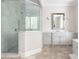Bathroom features a glass shower, marble countertops, and tiled floors at 22 Mount Paran Rd, Atlanta, GA 30327