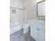 Bathroom featuring a tub, tiled walls, a white toilet, and a marble countertop sink at 22 Mount Paran Rd, Atlanta, GA 30327