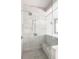 Bathroom features a shower, tiled walls, marble bench, and tiled floors at 22 Mount Paran Rd, Atlanta, GA 30327