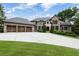 Beautiful brick home with a three car garage, large driveway, and professionally landscaped front yard at 22 Mount Paran Rd, Atlanta, GA 30327