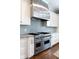 Gourmet kitchen featuring a Viking gas range and custom range hood at 22 Mount Paran Rd, Atlanta, GA 30327
