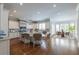 Open concept kitchen with large island, stainless appliances, hardwood floors, and a breakfast nook at 22 Mount Paran Rd, Atlanta, GA 30327