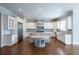 Bright kitchen with stainless steel appliances, granite counters and dark wood floors at 22 Mount Paran Rd, Atlanta, GA 30327