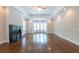 Bright living room features a fireplace, wood floors, and lots of windows at 22 Mount Paran Rd, Atlanta, GA 30327