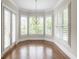 Living room with a bay window and modern chandelier at 22 Mount Paran Rd, Atlanta, GA 30327