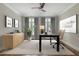 Bright home office features hardwood floors, modern desk, comfortable chair and plenty of natural light at 22 Mount Paran Rd, Atlanta, GA 30327
