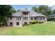 View of the rear of the home with expansive yard and patio at 22 Mount Paran Rd, Atlanta, GA 30327