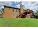 Expansive backyard with a wooden deck, lush lawn, and a view of the house, perfect for Gathering gatherings and summer barbecues at 2694 Sterling Dr, Lawrenceville, GA 30043