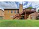 Well-kept backyard with a wooden deck, lush green lawn, and easy access to the house, excellent for outdoor living and relaxation at 2694 Sterling Dr, Lawrenceville, GA 30043