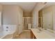 Bright bathroom featuring a soaking tub, glass shower, and spacious vanity with ample counter space at 2694 Sterling Dr, Lawrenceville, GA 30043
