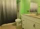 Bathroom featuring a shower, toilet, vanity with sink and a sleek, modern aesthetic at 2694 Sterling Dr, Lawrenceville, GA 30043