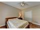 Cozy bedroom with wood floors, double closet, ceiling fan, and neutral paint at 2694 Sterling Dr, Lawrenceville, GA 30043