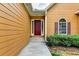 Inviting front door with sidelights, surrounded by manicured landscaping and charming architectural details at 2694 Sterling Dr, Lawrenceville, GA 30043