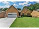 Charming single-Gathering home with a well-manicured lawn and a two-car garage in a serene neighborhood at 2694 Sterling Dr, Lawrenceville, GA 30043