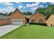 Charming single-Gathering home with a well-manicured lawn and a two-car garage in a serene neighborhood at 2694 Sterling Dr, Lawrenceville, GA 30043