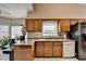Bright kitchen featuring wood cabinets, stainless steel appliances, and lots of natural light at 2694 Sterling Dr, Lawrenceville, GA 30043